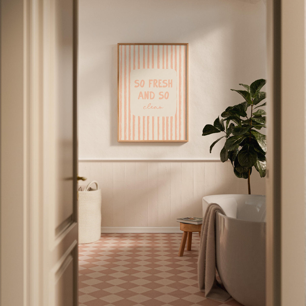Bathroom interior with a framed quote on the wall, plant, and bathtub.