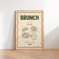Framed poster with 'Brunch Club' text and food illustrations on a white wall.