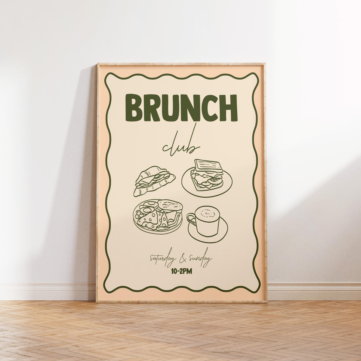 Framed poster with 'Brunch Club' text and food illustrations on a white wall.
