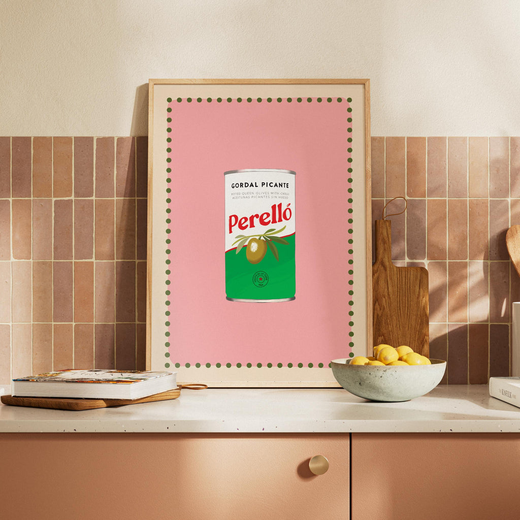Framed artwork of a Perello can on a kitchen counter with a tiled wall background