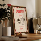 Framed poster with 'Coffee Club' design on a wooden surface with coffee-related items.