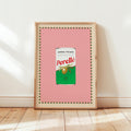 Framed artwork of a can labeled 'Perello' on a pink background
