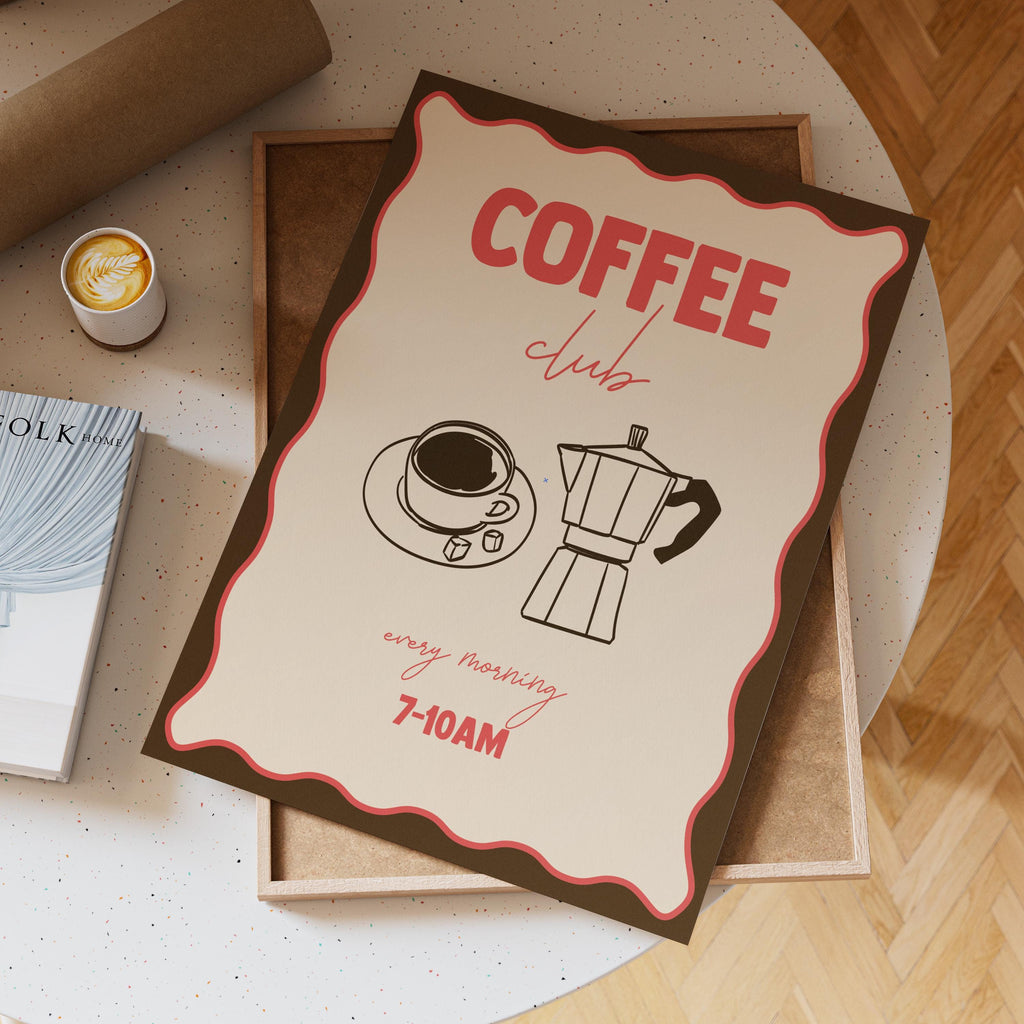Coffee club flyer on a table with a cup of coffee and book