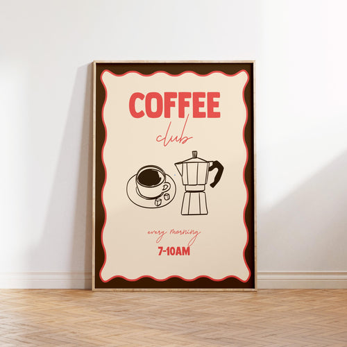 Framed poster with 'Coffee Club' design featuring a coffee cup and espresso machine on a white wall.