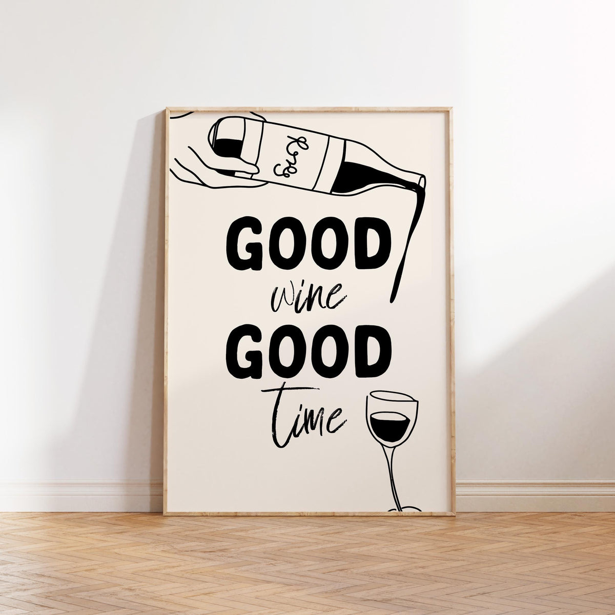 Framed artwork with 'Good wine Good time' text and wine graphics on a white wall.