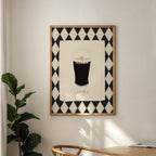 Framed artwork of a glass of Guinness with geometric pattern on wall