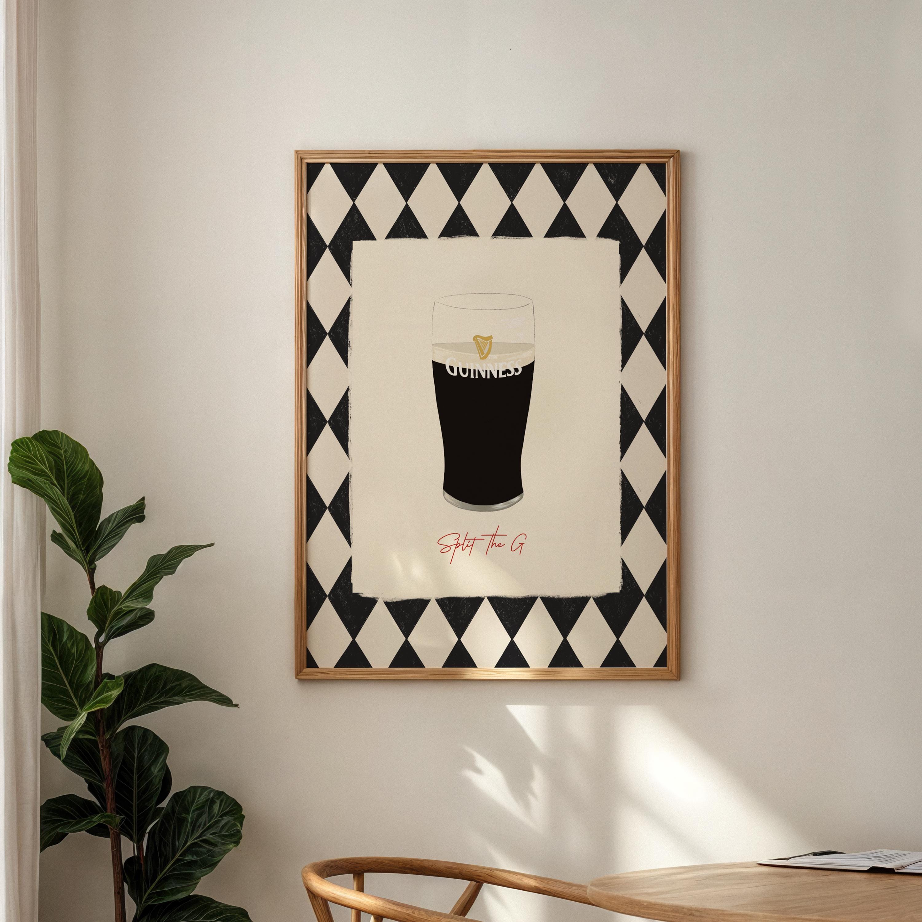 Framed artwork of a glass of Guinness with geometric pattern on wall