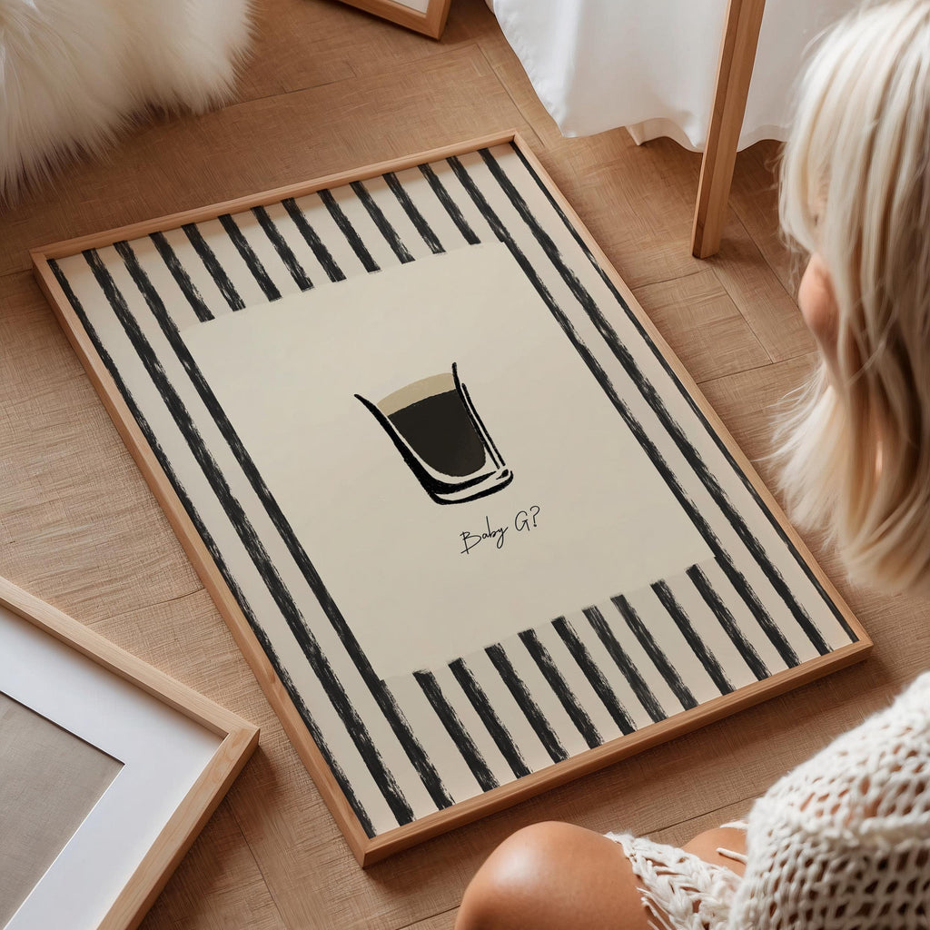 Person sitting on a wooden floor with a decorative rug featuring a coffee cup design.