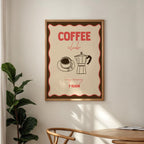Framed poster with 'Coffee Club' design on a wall above a wooden table.
