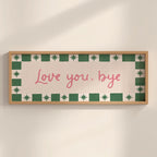 Framed artwork with 'Love you, bye' text on a beige background