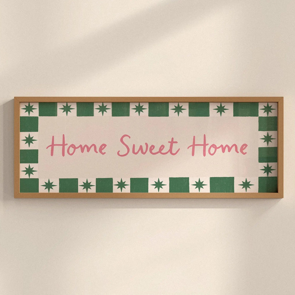 Decorative sign with 'Home Sweet Home' text on a wall