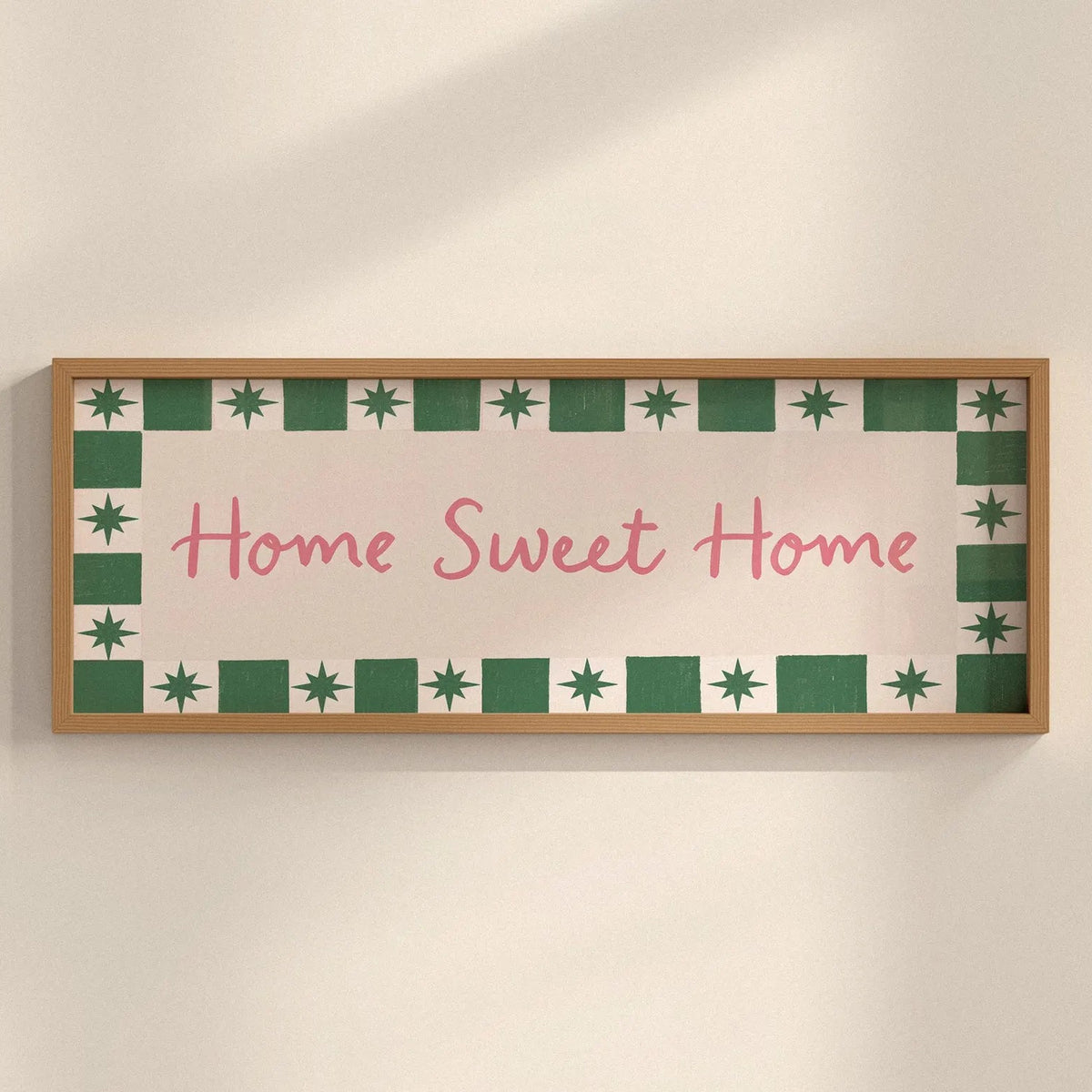 Decorative sign with 'Home Sweet Home' text on a wall