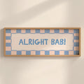 Framed sign with 'ALRIGHT BAB!' text on a checkered background