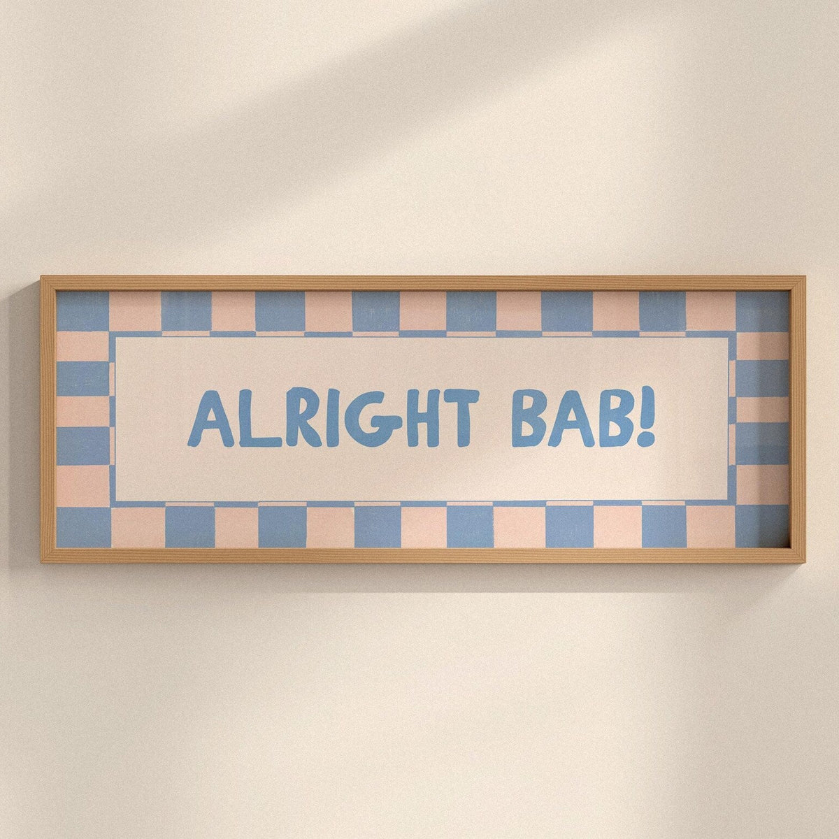 Framed sign with 'ALRIGHT BAB!' text on a checkered background